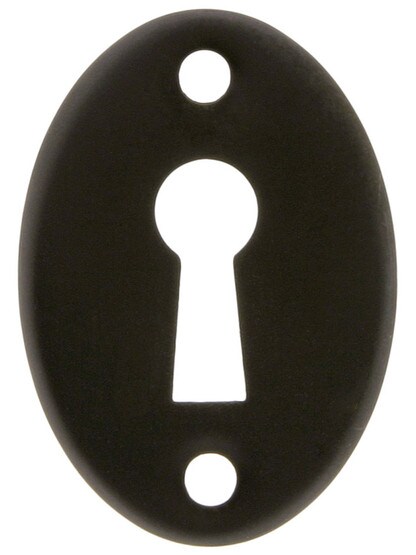 Stamped Brass Oval Keyhole Cover in Oil-Rubbed Bronze.